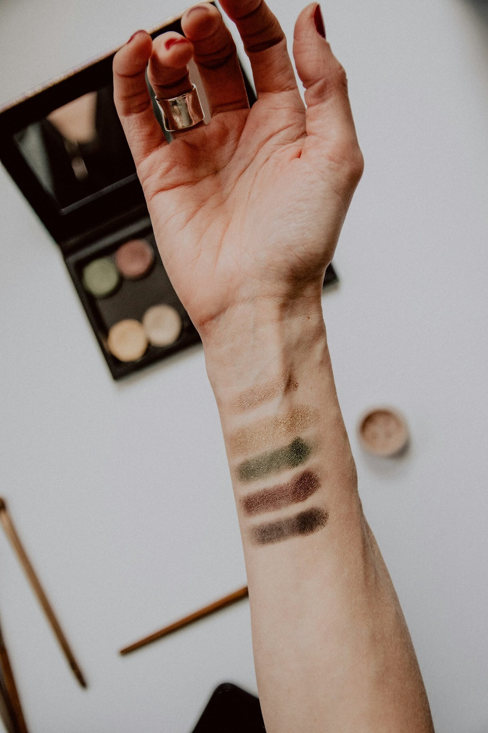 Arm showing eyeshadow swatches